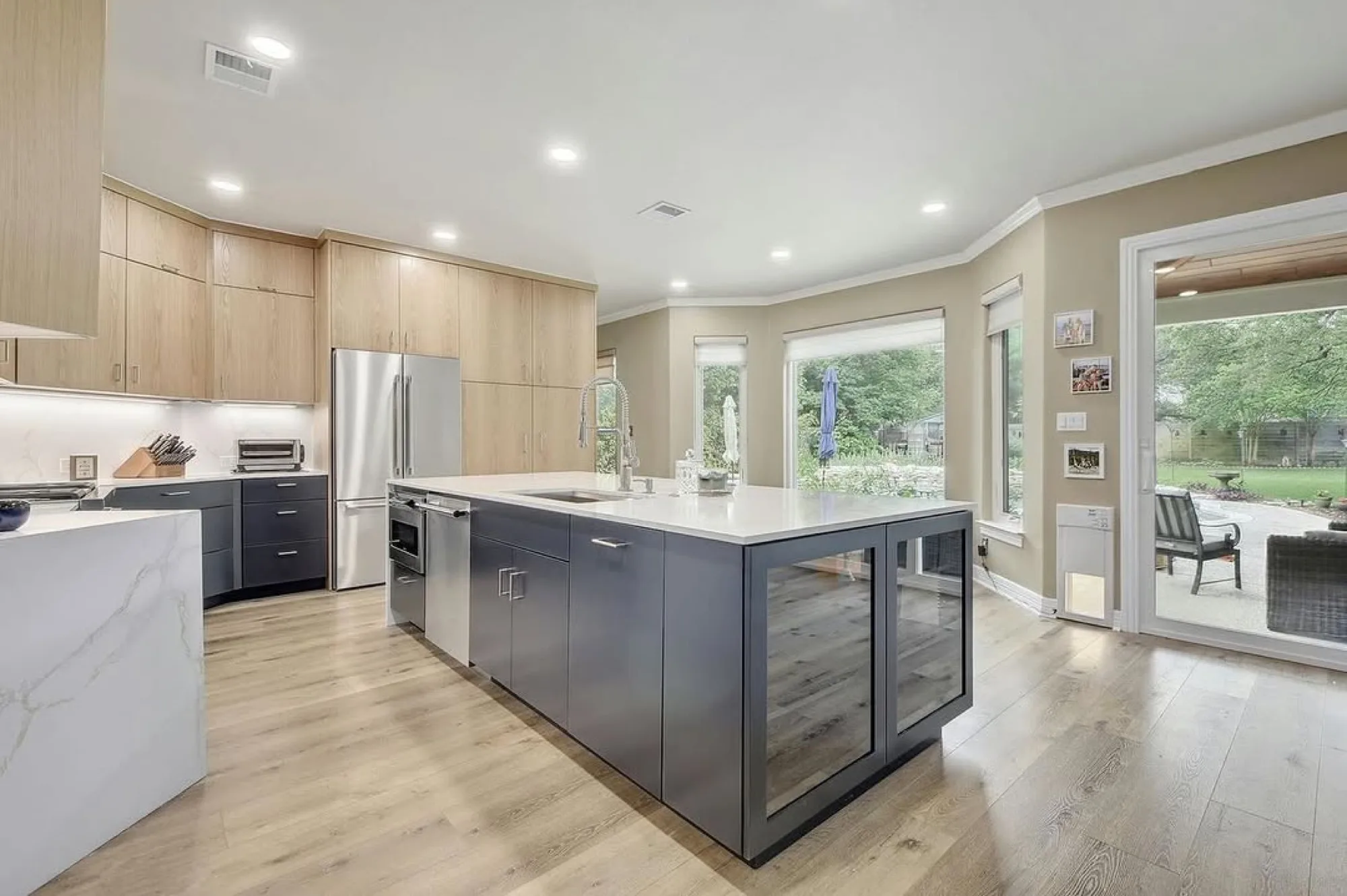Modern kitchen with island and two-tone cabinetry